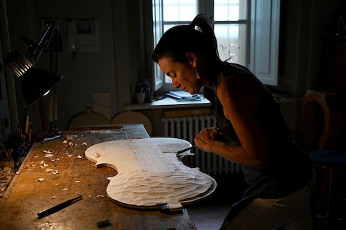 French violin maker Benedicte Friedmann works on the body of a violin in her Cremona workshop.
Image: Gabriel Bouys / AFP French violin maker Benedicte Friedmann works on the body of a violin in her Cremona workshop.
Image: Gabriel Bouys / AFP