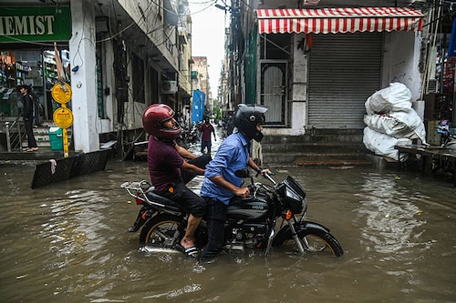 A man rides his bike through a flooded street after heavy rains lashed New Delhi. Image: Kabir Jhangiani/NurPhoto via Getty Images A man rides his bike through a flooded street after heavy rains lashed New Delhi. Image: Kabir Jhangiani/NurPhoto via Getty Images