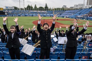 Members of the Meiji University "Oendan" cheering during a university baseball game at Meiji Jingu Baseball Park in Tokyo. Image: YUICHI YAMAZAKI / AFP©
