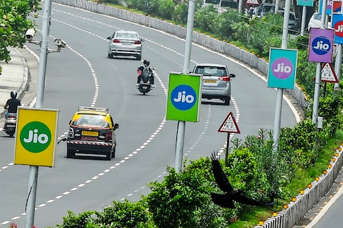 Jio Financial Services, the financial services arm of Reliance Industries, will be spun out of the company on July 20.
Image: Punit Paranjpe / AFP Jio Financial Services, the financial services arm of Reliance Industries, will be spun out of the company on July 20.
Image: Punit Paranjpe / AFP