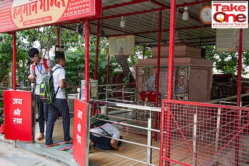 Students enter the Shri Das Hanuman Mandir in Rajiv Gandhi Nagar, Kota to offer prayers. Image: Kapil Kashyap