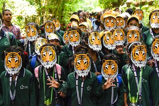 Students wearing tiger masks at an awareness march for save nature and tiger ahead of International Tiger Day at Sanjay Gandhi Biological Park, Patna Zoo in Bihar. In the last Tiger population census in India, the Tiger count increased to more than 3,000.