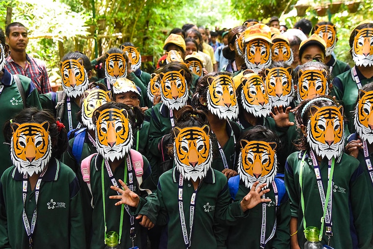 Students wearing tiger masks at an awareness march for save nature and tiger ahead of International Tiger Day at Sanjay Gandhi Biological Park, Patna Zoo in Bihar. In the last Tiger population census in India, the Tiger count increased to more than 3,000.
