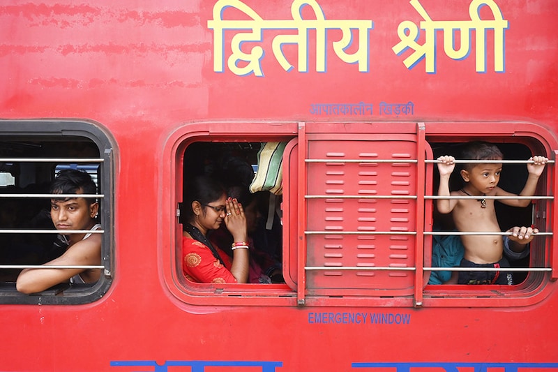 Passengers aboard the Chennai-bound Coromandel Express wait for the train departure at Shalimar station near Kolkata on June 7, 2023. One of the train services involved in a triple collision in India"s deadliest railway disaster in decades resumed journeys on June 7, as officials revised the death toll up to 288.