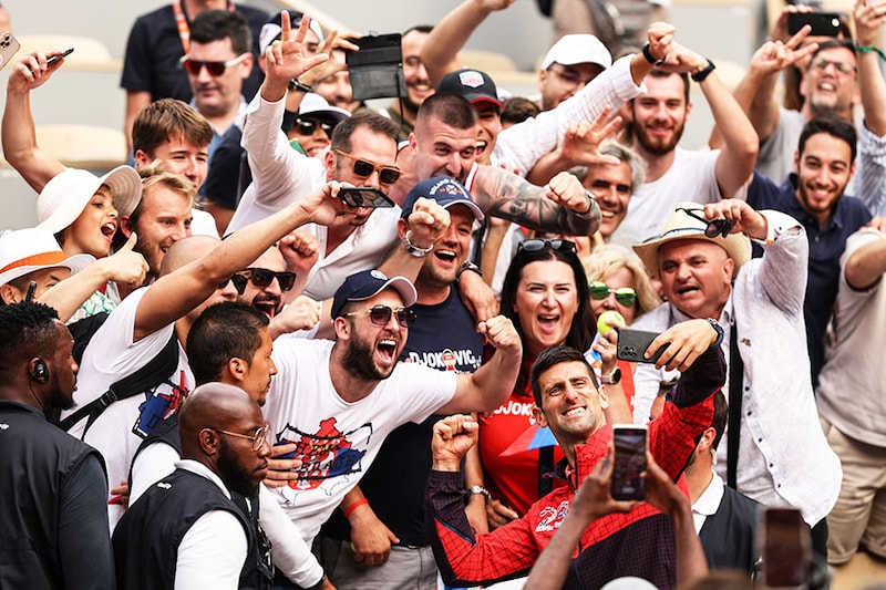 Novak Djokovic of Serbia takes a selfie with fans after victory against Casper Ruud of Norway in the Men"s Singles Final match on Day Fifteen of the 2023 French Open at Roland Garros on June 11, 2023, in Paris, France.