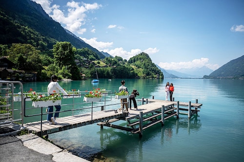 Tourists take a selfie photograph on the famous pier of a South Korean Netflix serie in the village of Iseltwald at the shore of Lake Brienz, in the Swiss Alps.
Image: Fabrice Coffrini / AFP