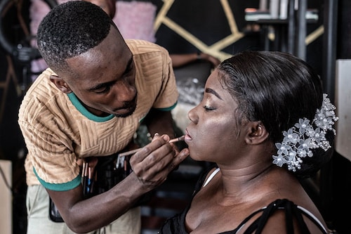 Djibril Gueye, also known as Djibou, the most popular Central African makeup artist, applies final touches to a bride-to-be at his beauty salon in Bangui.
Image: Barbara Debout / AFP