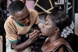 Djibril Gueye, also known as Djibou, the most popular Central African makeup artist, applies final touches to a bride-to-be at his beauty salon in Bangui.
Image: Barbara Debout / AFP