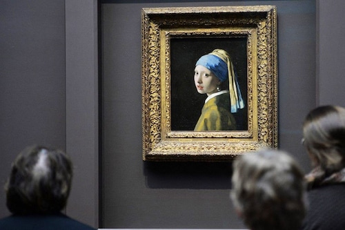The identity of the girl featured in Vermeer"s "Girl with a Pearl Earring" remains unknown to this day.
Image: Stan Honda / AFP