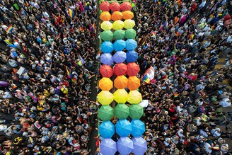 Aerial view of gender rights activists and members and supporters of the LGBTQ+ community taking part in the Pride Parade in Tijuana, Baja, California state, Mexico on June 24, 2023.