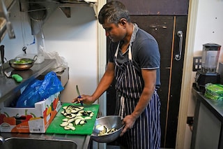 Staff prepare ingredients used in balti dishes in the kitchen of "Shababs" restaurant in the "Balti Triangle" area of Birmingham, central England.
Image: Oli Scarff / AFPÂ©