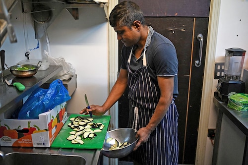 Staff prepare ingredients used in balti dishes in the kitchen of "Shababs" restaurant in the "Balti Triangle" area of Birmingham, central England.
Image: Oli Scarff / AFP© Staff prepare ingredients used in balti dishes in the kitchen of "Shababs" restaurant in the "Balti Triangle" area of Birmingham, central England.
Image: Oli Scarff / AFP©