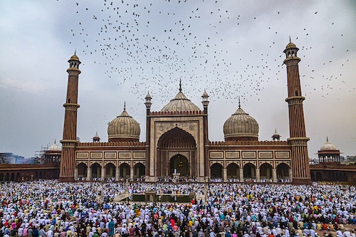 Muslim devotees offer Eid al-Adha prayers at Jama Masjid, at the old quarters of New Delhi, India, on June 29, 2023.