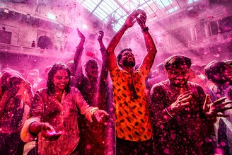 Devotees pray at Radha Ballav Temple during the Holi festival with colourful powders (Gulal). Radha Ballav Temple is one of the oldest and most auspicious temples, where Lord Krishna is worshipped during the Holi festival.