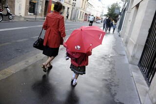 The motherhood penalty—the loss in lifetime earnings experienced by women raising children—has become the most significant driver of the gender pay gap," PwC says in its report. Image: Johanna Leguerre/ AFP
