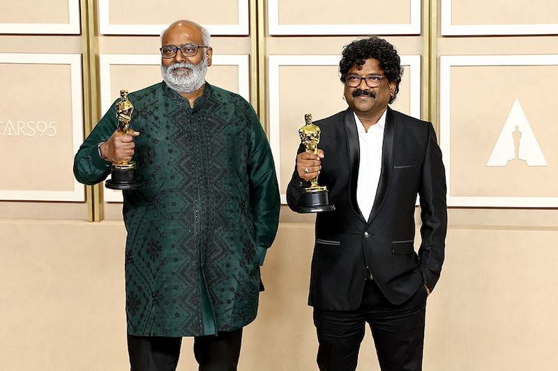 MM Keeravaani (L) and Chandrabose (R), winners of the Best Music (Original Song) award for "Naatu Naatu" from "RRR," pose in the press room during the 95th Annual Academy Awards on March 12, 2023, in Hollywood, California.