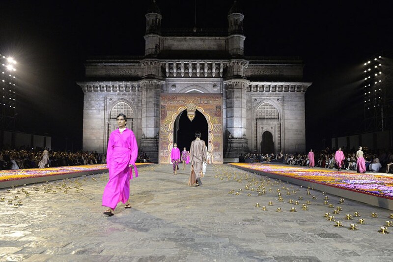 Models present creations from Christian Dior"s Fall 2023 collection during a fashion show at Gateway of India in Mumbai on March 30, 2023. House creative director Maria Grazia Chiuri’s collection referenced traditional Indian silhouettes. Experts believe this could be a watershed moment for India"s luxury fashion market.