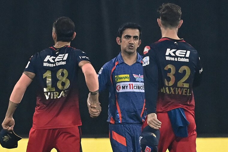 Lucknow Super Giants" team mentor Gautam Gambhir (C) shakes hands with Royal Challengers Bangalore"s Virat Kohli (L) and Glenn Maxwell (R) at the end of the Indian Premier League (IPL) Twenty20 cricket match between Lucknow Super Giants and Royal Challengers Bangalore at the Ekana Cricket Stadium in Lucknow on May 1, 2023. Indian cricket star Virat Kohli was fined on May 2, 2023, for the second time in this IPL season after a post-match altercation with former national teammate Gautam Gambhir. Both were docked their entire match fee, the Indian Premier League said, while Naveen-ul-Haq was fined 50 percent of his for breaching the league"s code of conduct.