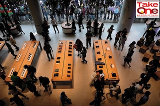 Visitors take a look at the various products on display at the inauguration of Apple’s first retail outlet in Mumbai Image: Anshuman Poyrekar/HT via Getty Images