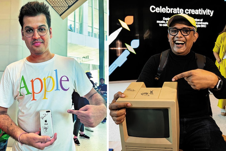 From left: Apple fanatics Purav Mehta and Sajid Moinuddin pose with their "priceless possessions" Image: Anshuman Poyrekar/HT via Getty Images