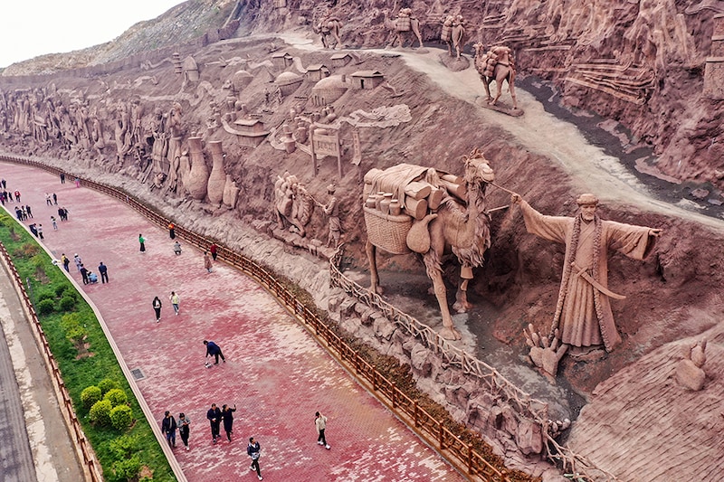 This photo taken on May 5, 2023, shows the relief of a large Cizhou kiln in the Fengfeng mining area of Handan City, North China"s Hebei Province. It is understood that the whole length of the mountain relief is nearly kilometres, and the average height is about 25 meters. More than 20 pictures are created in Cizhou Kiln, the market style of Pengcheng Ancient Town, the porcelain capital of thousands of years, the 72 processes of Cizhou kiln, and so on, showing the long history of Cizhou Kiln.