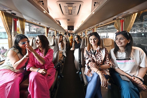 Passengers seen at the flag-off ceremony of India"s first all-women intercity electric bus from Kashmere Gate ISBT on May 16, 2023, in New Delhi, India. The feature-loaded intercity bus between Delhi and Agra is operated by women staff, and will provide women a luxurious and safe travel experience.