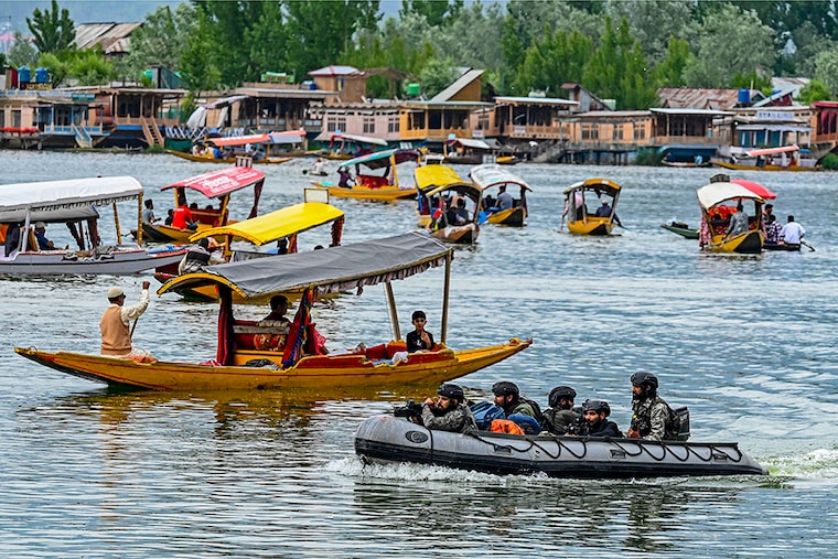 Indian Navy"s Marine Commandos (MARCOS) patrol Dal Lake in Srinagar on May 17, 2023, ahead of the upcoming G20 meeting.