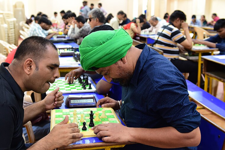 Visually challenged participants play on the first day of the ‘Gujarat State Selection Chess Tournament for the Blind 2023’ in Ahmedabad on May 19, 2023.