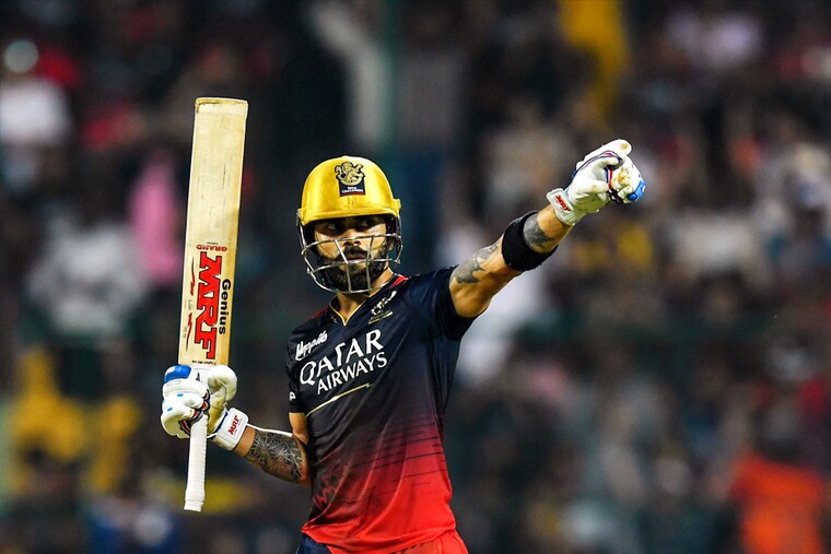 Royal Challengers Bangalore"s Virat Kohli celebrates after scoring a century during the Indian Premier League (IPL) Twenty20 cricket match between Royal Challengers Bangalore and Gujarat Titans at the M Chinnaswamy Stadium in Bengaluru on May 21, 2023.