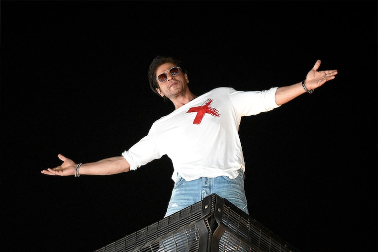 Bollywood actor Shah Rukh Khan strikes his iconic pose as he greets fans during his 58th birthday celebrations at his Mannat residence in Mumbai on November 2, 2023.