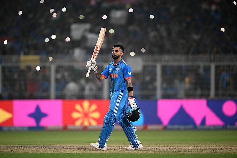 India"s Virat Kohli celebrates after scoring a century and equalling Sachin Tendulkar"s record of 49 ODI hundreds during the 2023 ICC Men"s Cricket World Cup match between India and South Africa at the Eden Gardens in Kolkata on November 5, 2023.