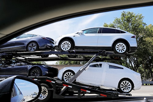 (File) Newly manufactured Tesla vehicles are transported along a freeway in Los Angeles, California, US, on August 24, 2018. Image: Reuters/Mike Blake (File) Newly manufactured Tesla vehicles are transported along a freeway in Los Angeles, California, US, on August 24, 2018. Image: Reuters/Mike Blake