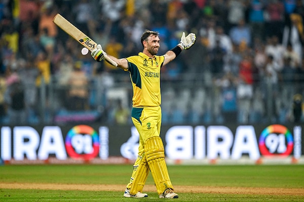 Australia"s Glenn Maxwell celebrates after winning the 2023 ICC Men"s Cricket World Cup one-day international (ODI) match between Australia and Afghanistan at the Wankhede Stadium in Mumbai on November 7, 2023. 
Image: Indranil Mukherjee / AFP