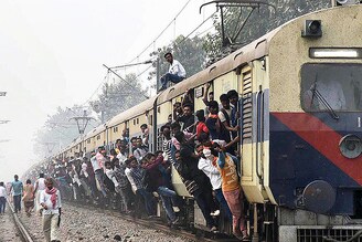 People travel by an overcrowded train to reach their hometowns ahead of the Chhath Puja festival at Patna Junction in Patna, India, on November 16, 2023.