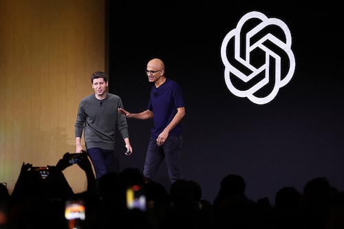 Microsoft CEO Satya Nadella (R) greets OpenAI CEO Sam Altman during the OpenAI DevDay event on November 06, 2023 in San Francisco, California. Altman delivered the keynote address at the first-ever Open AI DevDay conference.   Image: Justin Sullivan/Getty Images/AFP Microsoft CEO Satya Nadella (R) greets OpenAI CEO Sam Altman during the OpenAI DevDay event on November 06, 2023 in San Francisco, California. Altman delivered the keynote address at the first-ever Open AI DevDay conference.   Image: Justin Sullivan/Getty Images/AFP
