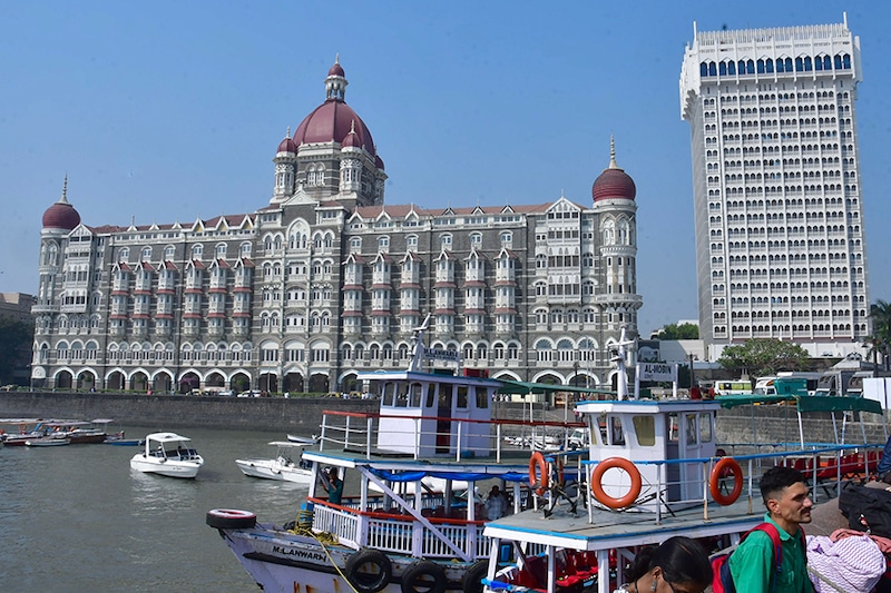Tourists outside the Taj Mahal Palace hotel, one of the sites of the 26/11, 2008 Mumbai terror attacks, ahead of the anniversary of the gruesome incident, on November 24, 2023 in Mumbai, India. The 2008 Mumbai attacks were a series of terrorist acts that took place in November 2008, when 10 members of Lashkar-e-Taiba, a militant Islamist organisation from Pakistan, carried out 12 coordinated shooting and bombing attacks lasting four days across Mumbai.
