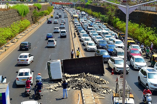 (File) An overturned truck is seen along a road after an accident along the Sarkhej-Gandhinagar highway near Ahmedabad. Image: Sam Panthaky/ AFP