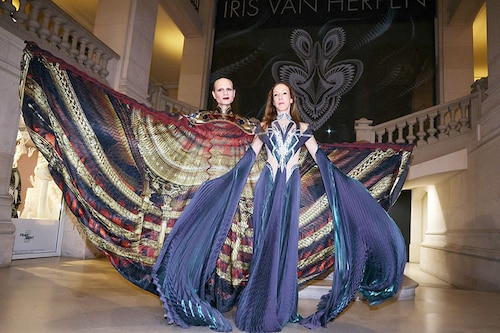 Dutch fashion designer Iris van Herpen (R) poses during the opening of her exhibition "Iris van Herpen: Sculpting the Senses" at the Musee des Arts Decoratifs, in Paris.
Image: Thomas Samson / AFPÂ©