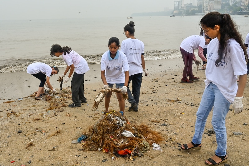 Young volunteers participate in a cleanliness drive at Girgaon Chowpatty, Mumbai on the eve of Mahatma Gandhi"s birth anniversary and Swachh Bharat Diwas on October 1, 2023 in Mumbai, India. The "Swachhata Hi Seva" campaign aims to promote community participation, emphasise the importance of a clean village and reinforce sanitation as a collective responsibility. Today, the October 2nd, is Mahatma Gandhi"s birth anniversary.
