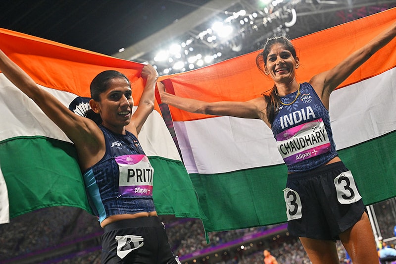 India"s Parul Chaudhary (R) and Priti Lamba celebrate after winning silver and bronze, respectively, in the women"s 3,000m steeplechase final during the 2022 Asian Games in Hangzhou, China, on October 2, 2023.
