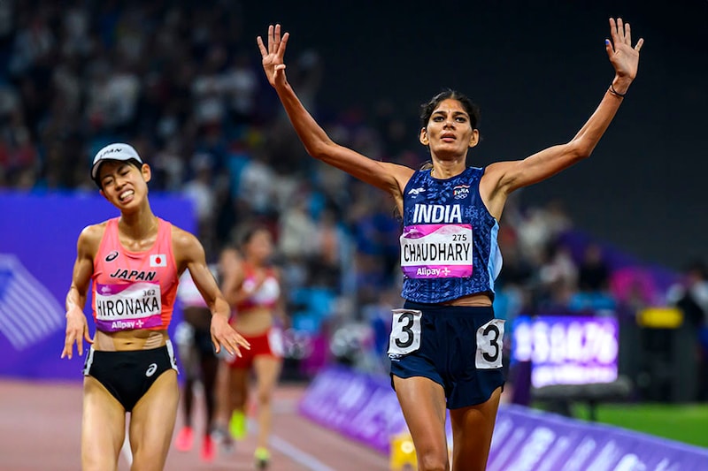 Parul Chaudhary (R) of India reacts after crossing the finish line to win the Women"s 5000m Final race of athletics event during the 19th Asian Games Hangzhou 2022 at Hangzhou Olympic Sports Centre in Hangzhou, Zhejiang Province of China on October 3 2023. Chaudhary grabbed the top spot with the timing of 15:14.75. This win follows on the heels of claiming a silver medal in the 3000m women"s steeplechase on Monday, October 2, 2023.
