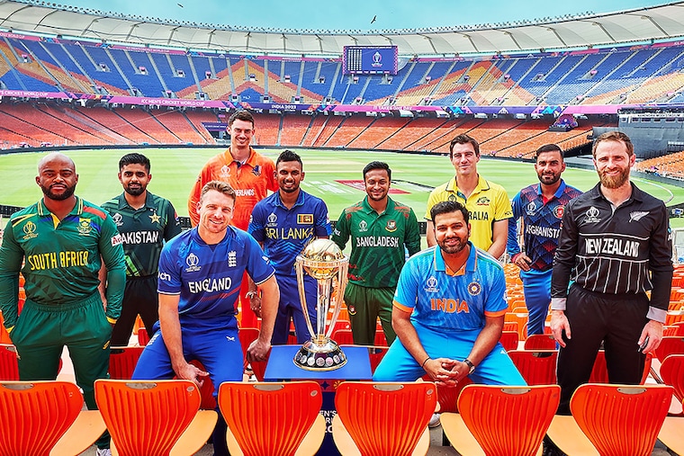 This handout photograph taken on October 4, 2023 and released by the International Cricket Council (ICC) shows (L-R) South Africa"s captain Temba Bavuma with his counterparts Pakistanàs Babar Azam, England"s Jos Buttler, Netherlands" Scott Edwards, Sri Lanka"s Dasun Shanaka, Bangladesh"s Shakib Al Hasan, Indiaàs Rohit Sharma, Australia"s Pat Cummins, Afghanistan"s Hashmatullah Shahidi and New Zealand"s Kane Williamson posing for a group photograph on the eve of the 2023 ICC men"s cricket World Cup opening match at the Narendra Modi Stadium in Ahmedabad.