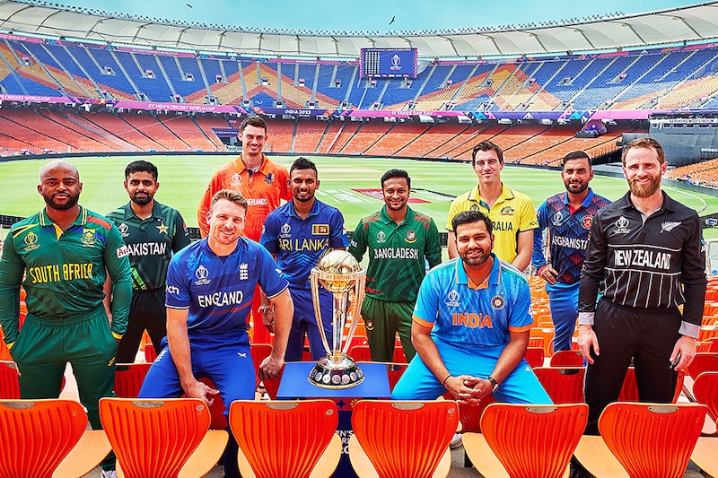 This handout photograph taken on October 4, 2023 and released by the International Cricket Council (ICC) shows (L-R) South Africa"s captain Temba Bavuma with his counterparts Pakistanàs Babar Azam, England"s Jos Buttler, Netherlands" Scott Edwards, Sri Lanka"s Dasun Shanaka, Bangladesh"s Shakib Al Hasan, Indiaàs Rohit Sharma, Australia"s Pat Cummins, Afghanistan"s Hashmatullah Shahidi and New Zealand"s Kane Williamson posing for a group photograph on the eve of the 2023 ICC men"s cricket World Cup opening match at the Narendra Modi Stadium in Ahmedabad.