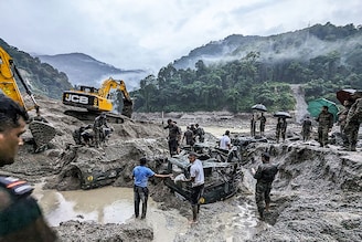 This handout picture released by India"s Ministry of Defence on October 5, 2023, shows Indian army personnel conducting a search operation for the missing soldiers in north Sikkim. The death toll from a devastating glacial lake burst that triggered a torrential flash flood in India has risen to at least 10 people, with 82 others still missing, according to officials.