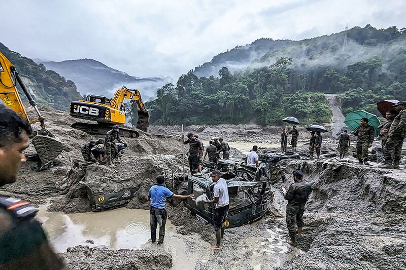 This handout picture released by India"s Ministry of Defence on October 5, 2023, shows Indian army personnel conducting a search operation for the missing soldiers in north Sikkim. The death toll from a devastating glacial lake burst that triggered a torrential flash flood in India has risen to at least 10 people, with 82 others still missing, according to officials.