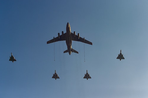 The Indian Airforce fighter jets and Globemaster (C) perform during the a rehersal airshow ahead of 91st Indian Airforce Day on October 8, in Prayagraj, Uttar Pradesh on October 6, 2023.