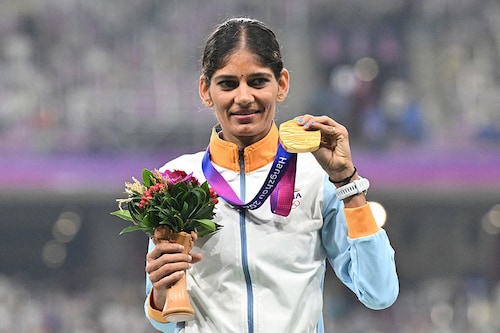 Gold medallist India"s Parul Chaudhary celebrates on the podium during the medal ceremony for the women"s 5,000m final athletics event during the 2022 Asian Games in Hangzhou in China"s eastern Zhejiang province on October 3, 2023. Image: Hector Retmal / AFP