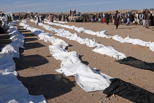 Afghan mourners prepare to offer mass funeral prayers for the people killed in a series of earthquakes in the Zendeh Jan district of Herat province on October 9, 2023. Afghan villagers and volunteers on October 9 helped dig for survivors of a series of earthquakes that killed more than 2,000 people as aid began trickling into the devastated region.
