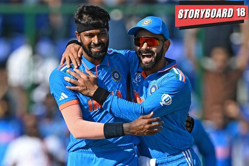 India"s Hardik Pandya (L) celebrates with teammate Virat Kohli after taking the wicket of Afghanistan"s Rahmanullah Gurbaz during the 2023 ICC Men"s Cricket World Cup one-day international (ODI) match between India and Afghanistan at the Arun Jaitley Stadium in New Delhi on October 11, 2023. Image: Money SHARMA / AFP