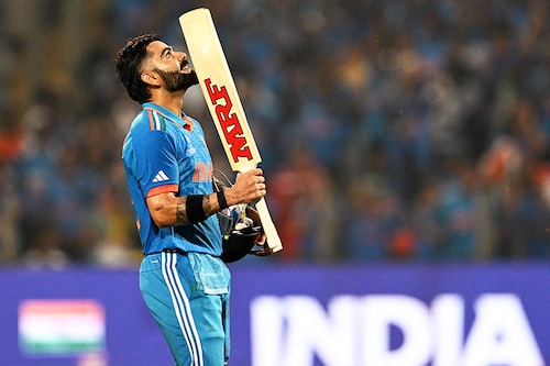 India"s Virat Kohli celebrates after scoring a century during the 2023 ICC Men"s Cricket World Cup ODI match between India and Bangladesh at the Maharashtra Cricket Association Stadium in Pune on October 19, 2023.